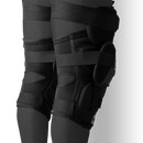 Bauer Pro Ice Hockey Goalie Knee Guards shown worn on legs, black colorway, front view