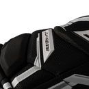 Close-up detail of Bauer Supreme Fuse ice hockey glove showing Supreme logo badge in black and white