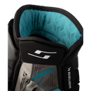 Close-up interior view of Bauer Supreme F40 ice hockey glove showing teal palm lining and padding