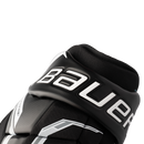 Close-up detail of Bauer Supreme ice hockey glove cuff showing bold Bauer logo in black and white