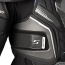Close-up detail of Bauer Supreme F50 Pro shoulder pad chest protection panel with logo