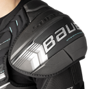 Close-up detail of Bauer Supreme shoulder pad showing Active Motion Protection cap and CollarShield technology