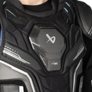 Close-up detail of Bauer Supreme F50 Pro shoulder pads showing Curv Composite chest plate