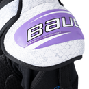 Close-up of Bauer Vapor shoulder pad cap showing purple Dynamic X Responsive branding detail