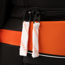Close-up detail of dual zipper pulls with orange and black accents on Bauer backpack