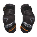 CCM Tacks youth ice hockey elbow pads in black and orange, pair shown side by side