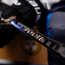 Close-up detail of Bauer Vapor Flylite hockey stick shaft with gold lettering