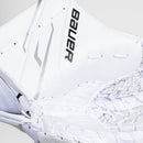 Close-up detail of Bauer GSX Ice Hockey Goalie Catcher in all-white colorway showing netting and logo