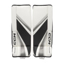 CCM Phenom youth ice hockey goalie leg pads in white and black colorway, front view