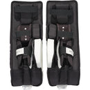 CCM Phenom Youth Ice Hockey Goalie Leg Pads in black and white, back interior view showing straps
