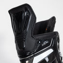 Close-up detail of CCM XR90 black ice hockey skate showing ankle support and boot construction
