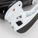 Close-up detail of CCM XS blade holder and steel runner on junior ice hockey skate
