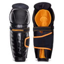 CCM Tacks XR Pro youth hockey shin guards shown front and back view, black and orange