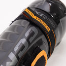 Close-up detail of CCM Tacks XR Pro shin guard strap system in black and orange
