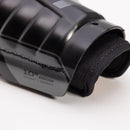 Close-up detail of CCM Tacks XR Pro youth hockey shin guard showing textured shell and inner padding, 10 inch right