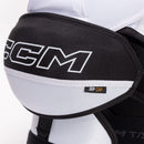 Close-up detail of CCM Tacks XR 80 shoulder pad cap with JDP CAP label in black and white